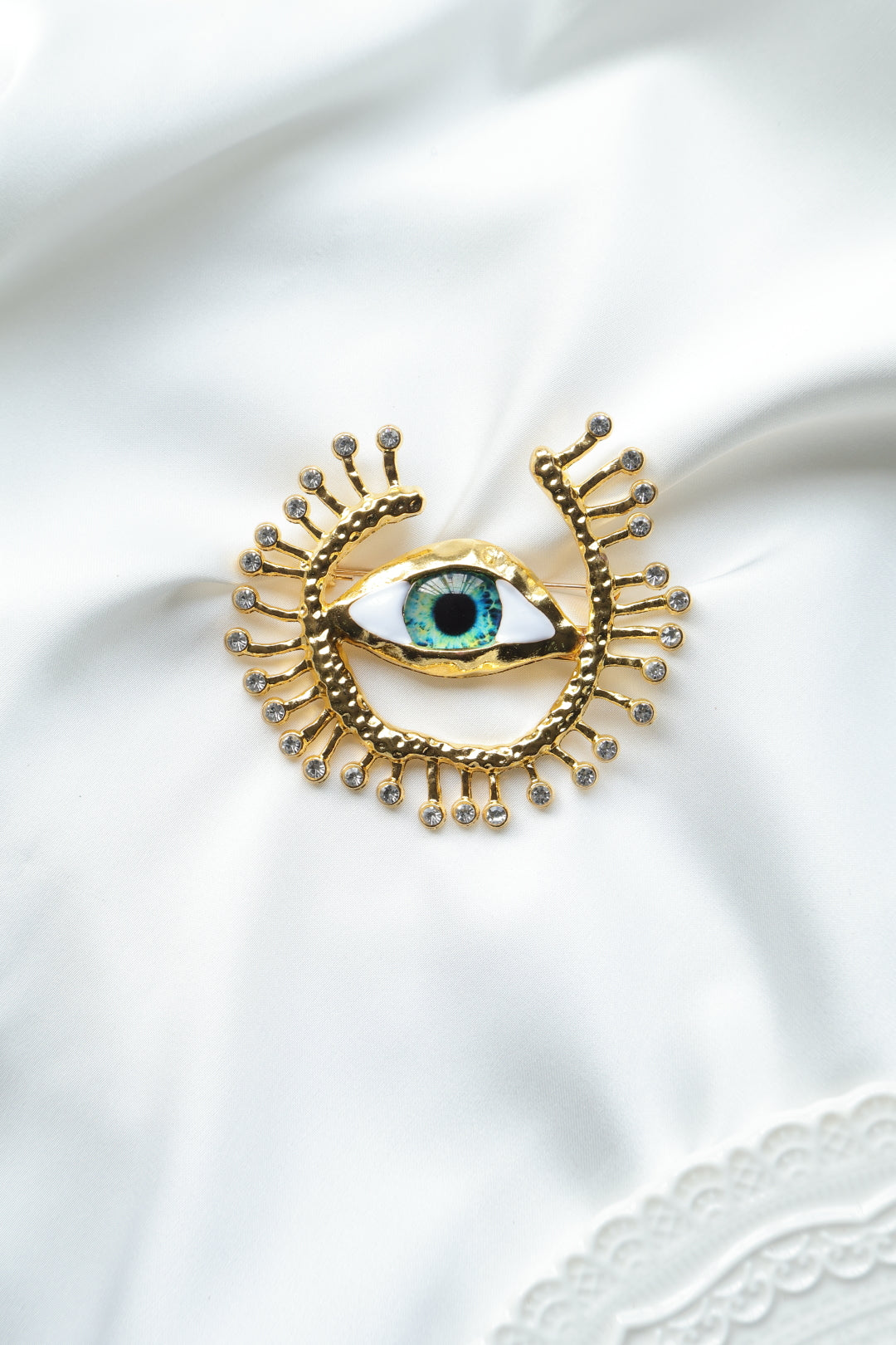 BROCHE OJO DORADO